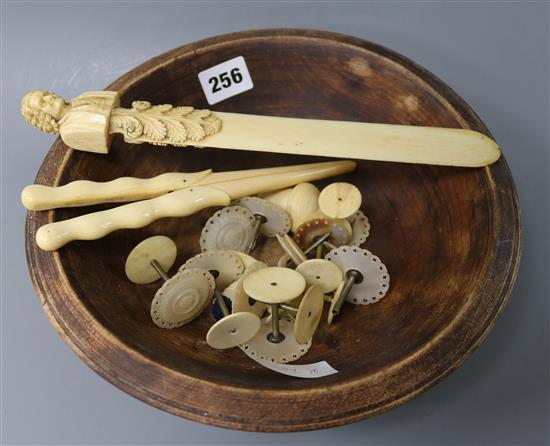 A carved ivory page turner, sewing tools, glove stretchers